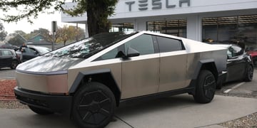 Cybetruck parked in front of Tesla store