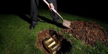 Man burying gold