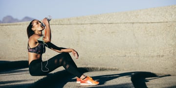 Athlete sitting and drinking water