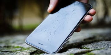 Broken iPhone on the ground