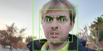 A man getting his face scanned by AI.