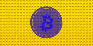 Bitcoin cryptocurrency logo superimposed on Lego brick pattern background