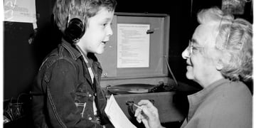A retro pic of a medical practitioner helping a child hear successfully.