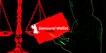 hacker holding samourai wallet logo on scale
