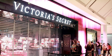 Victorias secret store about to open, pink light, people in line