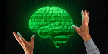 green glowing brain with human hands in matrix number background