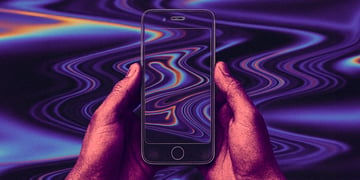A pair of hands holding a transparent phone.