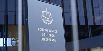 Court Justice of the European Union logo in front of glass building
