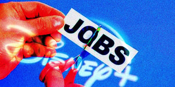 A hand cutting a piece of paper that says "Jobs" superimposed on Disney logo