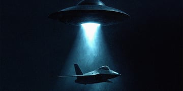 A UFO flying in the dark above a stealth bomber.