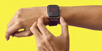 Apple Watch on a wrist measuring a heart beat
