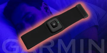 garmin black watch with text Garmin in front of a man sleeping in blue