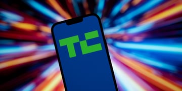 green techcrunch logo in blue background telephone screen