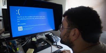 A computer displaying a Windows error screen, a.k.a Blue Screen of Death