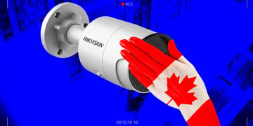 hand with canadian flag on hikvision camera