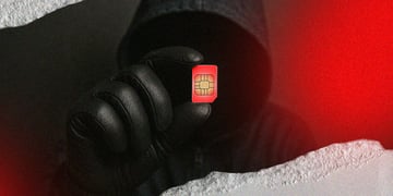 Hacker holding SIM card