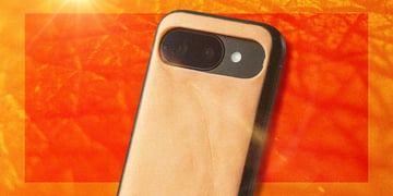 A mobile phone with human-like skin, amid a sunny backdrop.