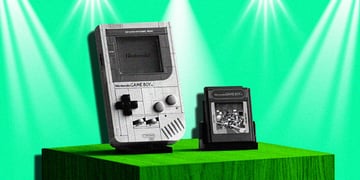 old nintendo game boy in black and white, green background