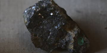 black sparkly rock on a brown material