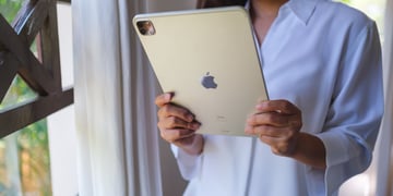 Woman holding iPad Pro