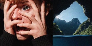 curley ginger hair, two pupils in one eye, lace, cave, blue sky, open mouth