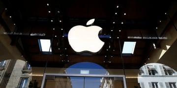 white shiny apple logo surrounded  by dark glass