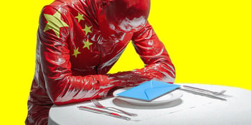 china flag man sitting on the table looking at a mail letter
