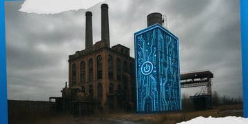 brown power plant, two chimney, grey sky, blue and white chip-like data centre with on button
