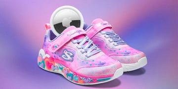 pink shoe with colorful hears on the sole with silver Apple disc