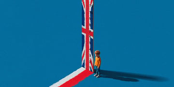 vertical ruler, uk flag, white ginger kid, orange top, jeans, blue background