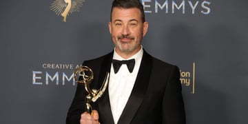 Comedian Jimmy Kimmel holding an Emmy award