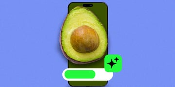 A half of a ripe avocado on a smartphone