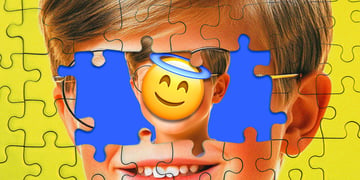 A child with an emoji covering his face