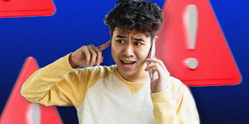 young black man block his ear, talks over the phone, alarm signs
