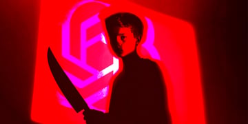 A menacing picture of a friend holding a knife, intending to kill a friend.