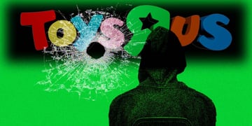 Toys 'R' Us logo with a bullet hole
