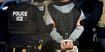 police officers back, black vest, ice