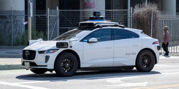 Waymo self-driving cart parked in street