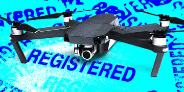 black frone on light electric blue sign REGISTERED