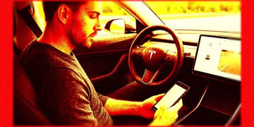 Driver texting in Tesla
