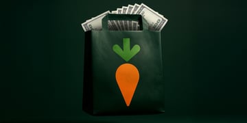 A black bag full of money with an image of a carrot on it