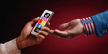 Two hands, one of the presidents, a smartphone with social media icons on the display.