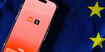 Temu and Shein apps on an iPhone screen with EU flag in the background
