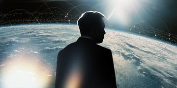 Elon Musk's silhouette over planet Earth.