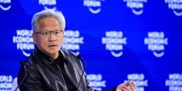 Jensen Huang, grey hair, black leather jacket, blur photo wall, world economic forum