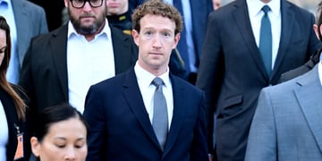 Mark Zuckerberg, pale skin, blue tie, white collar shirt, pale skin, curly light brown hair