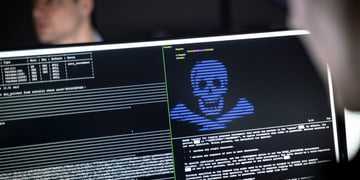 blurry man face in left top corner, black screen, white and blue letters, human scull