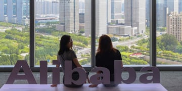 alibaba_White Alibaba logo, 4 big windows, city park, big buildings, two asian girls