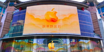 orange apple logo in China with Chinese sign and horse motif