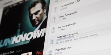 james-bond-ish movie poster on left, shadowy man's face, black suit, white download page with files